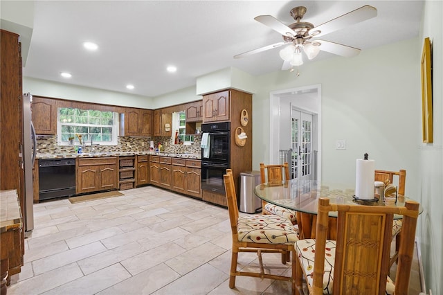 kitchen with black appliances, recessed lighting, light countertops, decorative backsplash, and ceiling fan