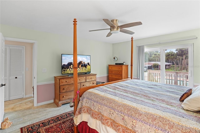 bedroom with ceiling fan, baseboards, wood finished floors, and access to exterior