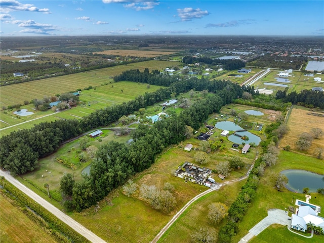 birds eye view of property featuring a rural view and a water view