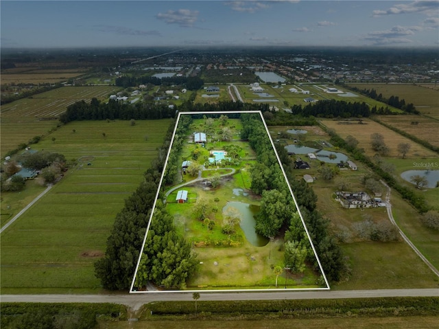 birds eye view of property featuring a rural view