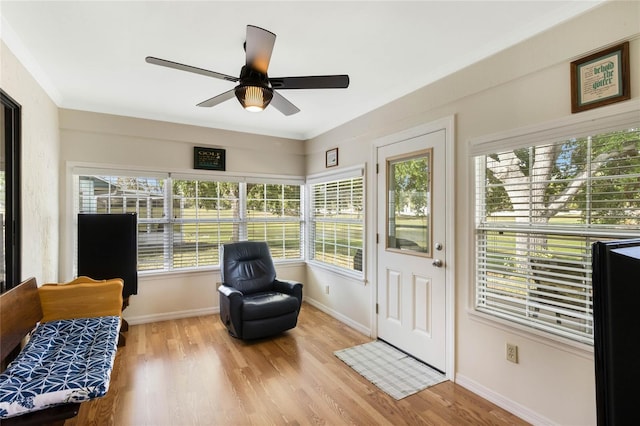 sunroom / solarium with ceiling fan