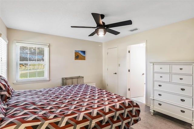 bedroom with visible vents, carpet floors, and ceiling fan