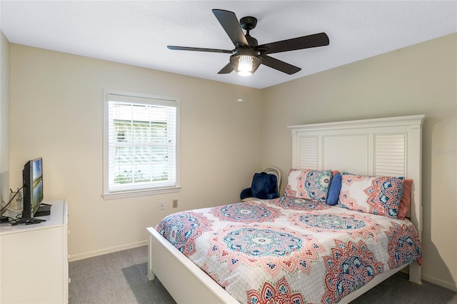 carpeted bedroom featuring a ceiling fan and baseboards