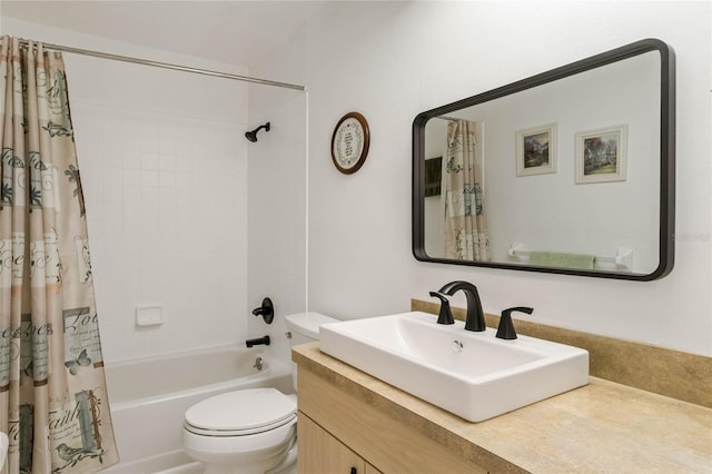 bathroom with vanity, toilet, and shower / tub combo