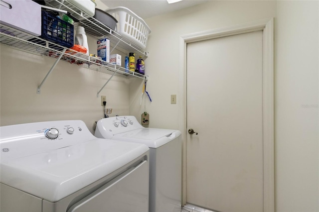 washroom featuring washer and dryer and laundry area