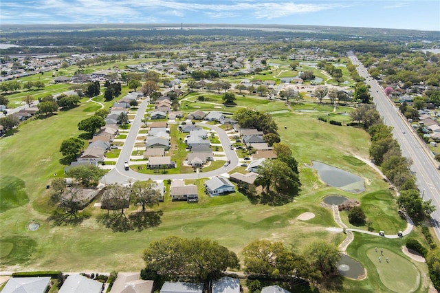 birds eye view of property with a residential view and golf course view