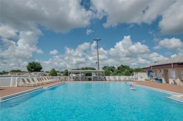 community pool featuring fence