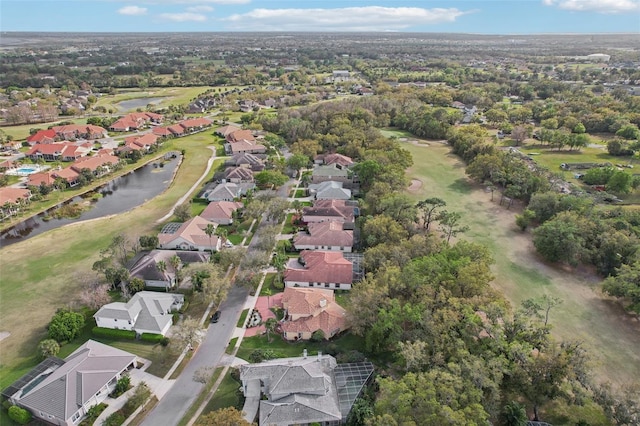 drone / aerial view with a residential view and a water view