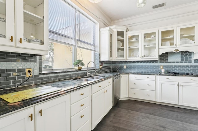 kitchen featuring visible vents, dishwasher, ornamental molding, white cabinets, and a sink