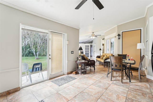 dining space with baseboards, crown molding, and ceiling fan