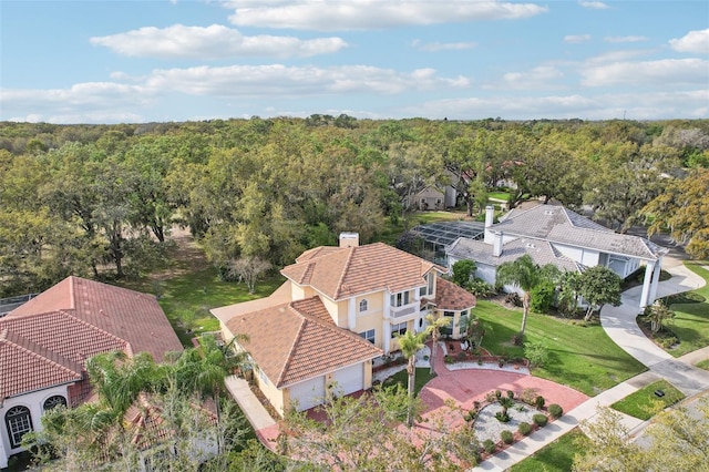 aerial view featuring a wooded view