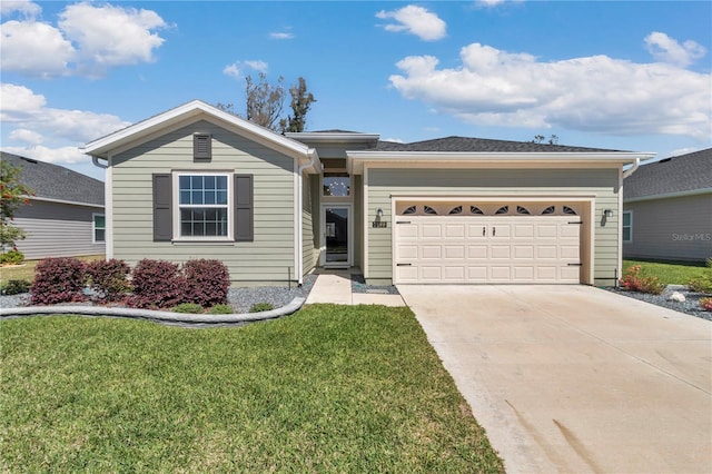 single story home with a garage, concrete driveway, and a front lawn