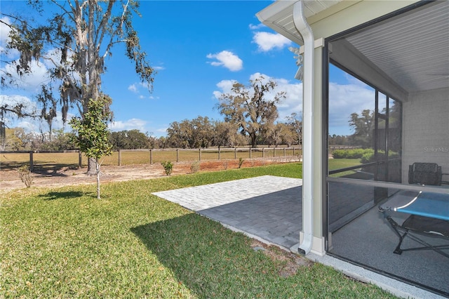 view of yard featuring fence and a patio area