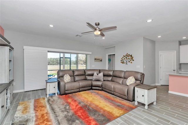 living room featuring visible vents, baseboards, wood tiled floor, ceiling fan, and recessed lighting