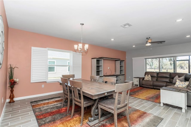 dining room with ceiling fan with notable chandelier, recessed lighting, baseboards, and visible vents