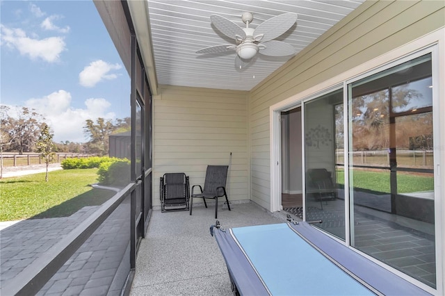 view of patio featuring ceiling fan