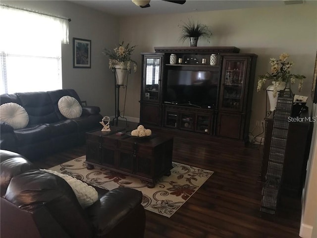 living room featuring ceiling fan and wood finished floors