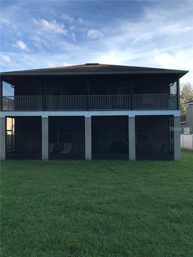 rear view of house with a lawn