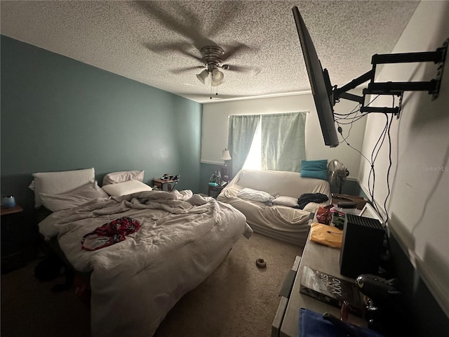 carpeted bedroom with a textured ceiling and ceiling fan