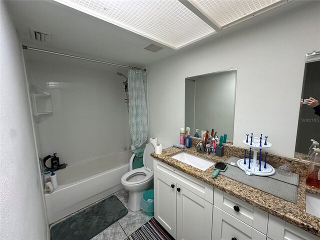 bathroom featuring toilet, vanity, visible vents, and shower / bathtub combination with curtain