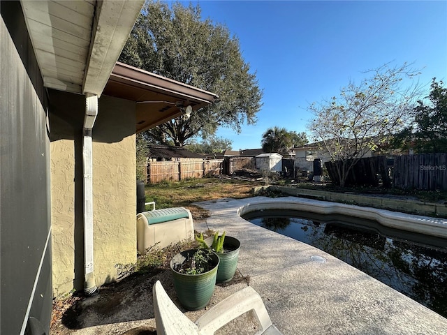 view of pool with a patio, a fenced backyard, and a fenced in pool