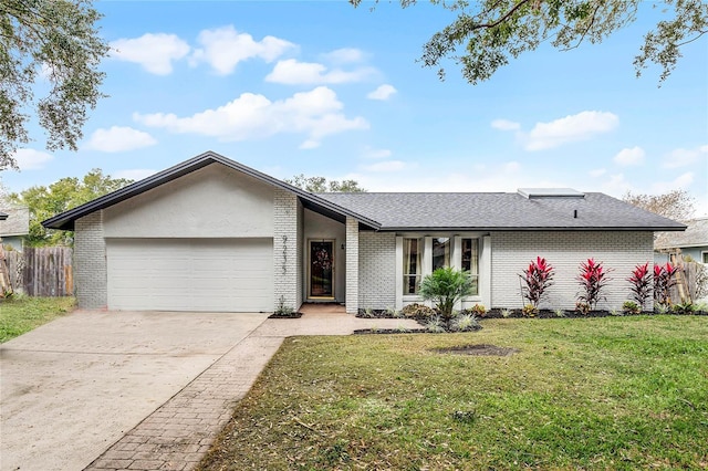 mid-century modern home featuring a garage, concrete driveway, fence, a front lawn, and brick siding