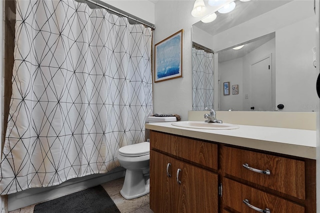 bathroom with toilet, tile patterned floors, and vanity