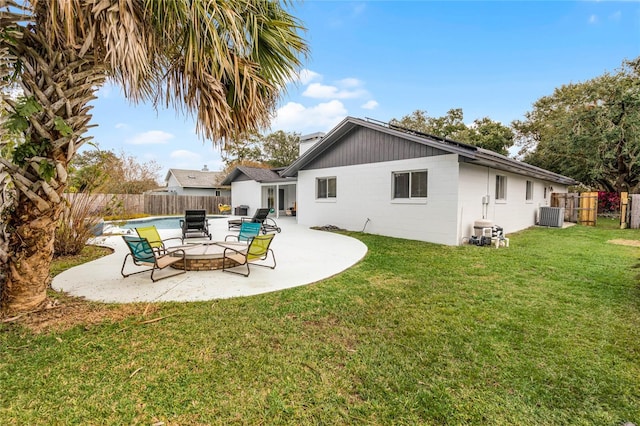 back of house featuring a yard, a fenced backyard, central AC unit, and a patio