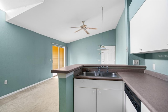 kitchen with white cabinets, dishwasher, light colored carpet, lofted ceiling, and a sink