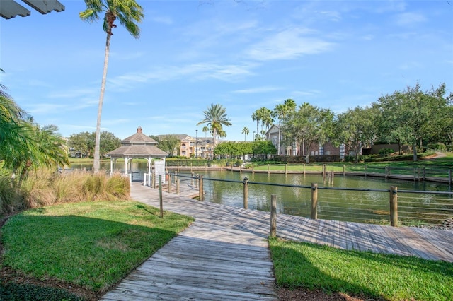 view of dock featuring a gazebo and a water view