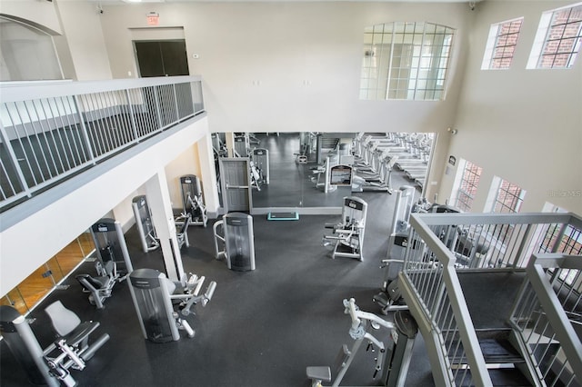 workout area with a high ceiling