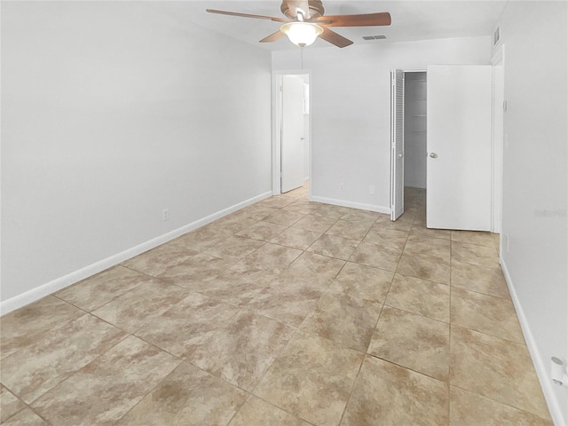 unfurnished bedroom featuring tile patterned flooring, a closet, visible vents, and baseboards