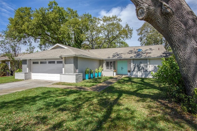 single story home featuring a garage, a front lawn, concrete driveway, and brick siding