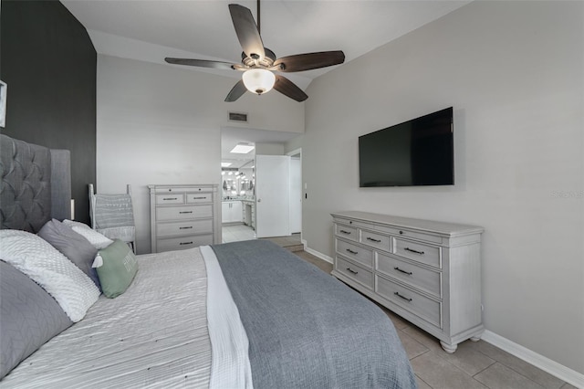 bedroom with light tile patterned floors, baseboards, visible vents, connected bathroom, and ceiling fan