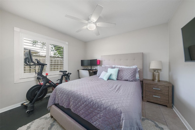 bedroom with ceiling fan and baseboards