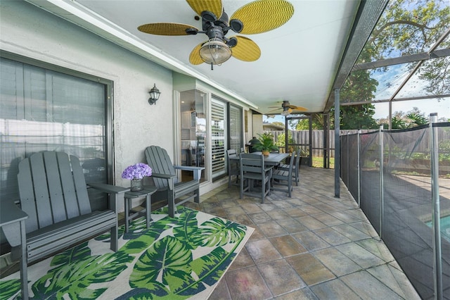 sunroom / solarium with ceiling fan and a healthy amount of sunlight