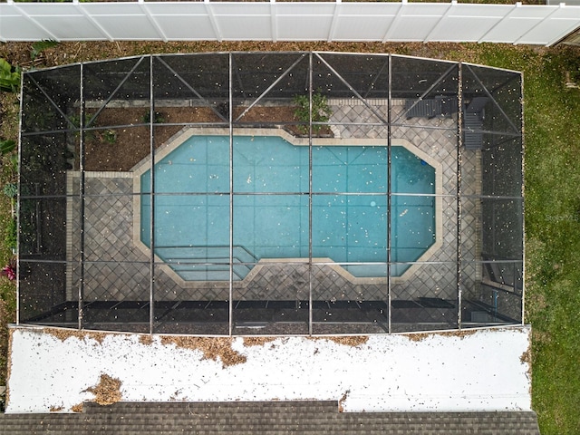 outdoor pool featuring a lanai