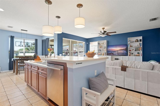 12824 Penshurst Ln, Windermere, FL 34786 - kitchen featuring visible vents, open floor plan, stainless steel dishwasher, and light countertops