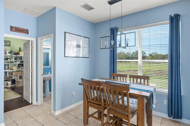 12824 Penshurst Ln, Windermere, FL 34786 - dining space featuring baseboards, visible vents, and light tile patterned flooring