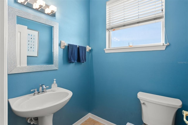 12824 Penshurst Ln, Windermere, FL 34786 - bathroom featuring a sink, toilet, and tile patterned floors