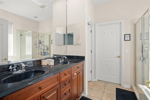 12824 Penshurst Ln, Windermere, FL 34786 - bathroom featuring a sink, a shower stall, and tile patterned floors