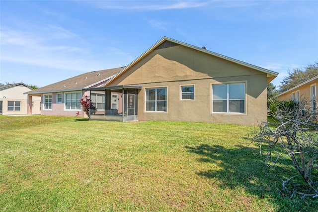 12824 Penshurst Ln, Windermere, FL 34786 - back of house with a lawn and stucco siding