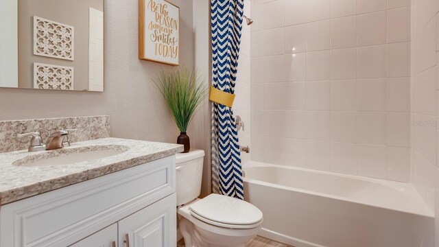 bathroom featuring shower / tub combo, vanity, and toilet