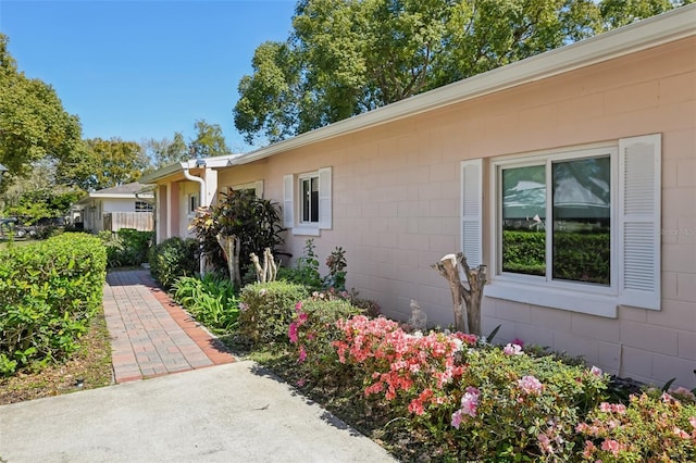 exterior space with concrete block siding