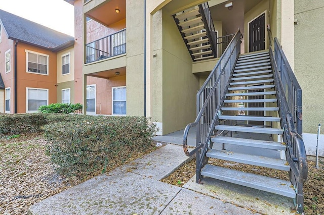 view of exterior entry featuring stucco siding