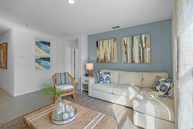 living area featuring visible vents and baseboards