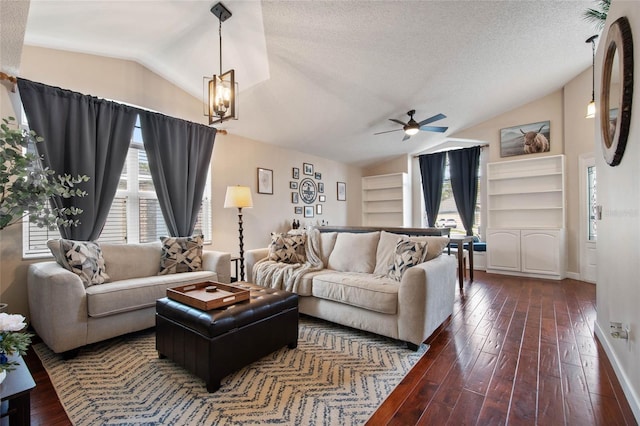 living area featuring built in features, a textured ceiling, hardwood / wood-style floors, ceiling fan, and vaulted ceiling