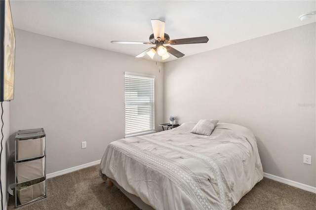 carpeted bedroom featuring baseboards and a ceiling fan