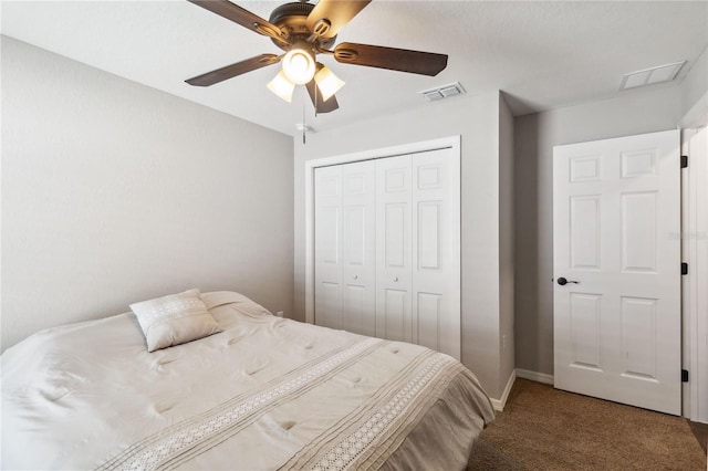 carpeted bedroom featuring visible vents, baseboards, a closet, and a ceiling fan