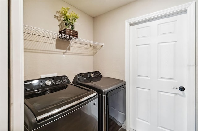 laundry area featuring laundry area and separate washer and dryer